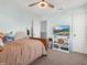 This bedroom features a ceiling fan, natural light, a TV and comfortable decor at 6915 Diamondleaf Way, Brownsburg, IN 46112
