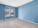 Bedroom with two windows letting in natural light with neutral carpet and light blue walls at 6915 Diamondleaf Way, Brownsburg, IN 46112