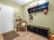 This warm entryway features a coat rack, shoe storage, and a cute seating area at 6915 Diamondleaf Way, Brownsburg, IN 46112