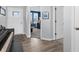 Hallway with a staircase, piano, and views of the front door and an adjacent room at 6915 Diamondleaf Way, Brownsburg, IN 46112