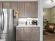 Clean kitchen featuring stainless steel fridge and coffee bar adjacent to seating area at 6915 Diamondleaf Way, Brownsburg, IN 46112