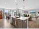 Bright and open concept living area with island, dining and a living room at 6915 Diamondleaf Way, Brownsburg, IN 46112