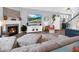 Open-concept living room with fireplace, plush seating, and modern decor at 6915 Diamondleaf Way, Brownsburg, IN 46112