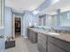 This bathroom has beautiful granite counters, double sinks, and a walk-in closet at 6915 Diamondleaf Way, Brownsburg, IN 46112