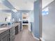 This bathroom features granite countertops, double sinks and a walk-in shower at 6915 Diamondleaf Way, Brownsburg, IN 46112