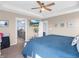 This is a view of the main bedroom with a view into the ensuite bath with gray cabinets and granite counters at 6915 Diamondleaf Way, Brownsburg, IN 46112