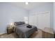 Comfortable bedroom with neutral tones, wood-look flooring, and ample closet space at 721 E Morris St, Indianapolis, IN 46203