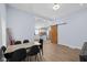 Dining room with view to kitchen, modern table and chairs, and stylish barn door at 721 E Morris St, Indianapolis, IN 46203