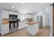 Well-equipped kitchen with stainless steel appliances, white cabinets, and butcher block countertops at 721 E Morris St, Indianapolis, IN 46203