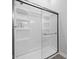 Modern shower with sliding glass door and white acrylic surround at 721 E Morris St, Indianapolis, IN 46203