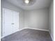 Bedroom featuring a window and a large closet with white bi-fold doors at 7228 Broadacre Ct, Carmel, IN 46033