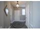 Inviting entryway with neutral paint, wood-look floors, and a stylish light fixture at 7228 Broadacre Ct, Carmel, IN 46033