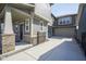 A modern home features a long driveway leading to a two-car garage, accented by neutral siding, and trimmed landscaping at 7228 Broadacre Ct, Carmel, IN 46033