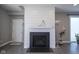 Living room fireplace with shiplap accent and decorative lighting at 7228 Broadacre Ct, Carmel, IN 46033