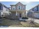 Charming two-story home featuring a covered front porch, a well-maintained lawn, and a welcoming entrance, perfect for curb appeal at 7228 Broadacre Ct, Carmel, IN 46033