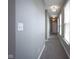 Long hallway with neutral paint, carpet, and modern lighting fixtures at 7228 Broadacre Ct, Carmel, IN 46033