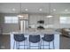 This kitchen boasts stainless appliances, granite countertops and bar seating at the island at 7228 Broadacre Ct, Carmel, IN 46033