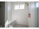 Modern tiled shower featuring a built-in bench and a dual shower head system at 7228 Broadacre Ct, Carmel, IN 46033