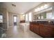 A luxurious bathroom boasts a soaking tub, double vanities, and ample natural light for a spa-like experience at 7239 Bellini Ln, Indianapolis, IN 46259