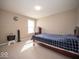 A tranquil bedroom features a bed, a window, and soft lighting for a calming atmosphere perfect for relaxation at 7239 Bellini Ln, Indianapolis, IN 46259