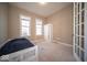 Cozy bedroom with carpet, natural light, and a built-in closet unit at 7239 Bellini Ln, Indianapolis, IN 46259