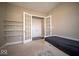 Bright bedroom with a bed, carpet, and built in shelves at 7239 Bellini Ln, Indianapolis, IN 46259