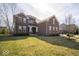 Attractive brick home with a neat front lawn and mature trees adding to its curb appeal at 7239 Bellini Ln, Indianapolis, IN 46259