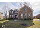 Charming two-story brick home with a well-manicured lawn and a welcoming entrance at 7239 Bellini Ln, Indianapolis, IN 46259