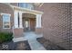 Inviting front porch featuring classic columns and a sheltered entryway at 7239 Bellini Ln, Indianapolis, IN 46259