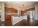 Modern kitchen with sleek cabinetry, granite countertops, stainless steel appliances, and stylish lighting at 7239 Bellini Ln, Indianapolis, IN 46259