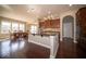 Well-appointed kitchen with a central island and stainless steel appliances, adjacent to a dining area at 7239 Bellini Ln, Indianapolis, IN 46259