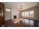 Elegant living room featuring hardwood floors, a fireplace, and plenty of natural light at 7239 Bellini Ln, Indianapolis, IN 46259