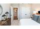 Comfortable bedroom showcasing neutral walls, carpet, and an ensuite bathroom at 7572 Bluegill Dr, Noblesville, IN 46062