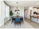 Elegant dining room with a stylish table, comfortable chairs, and an open view to the kitchen at 7572 Bluegill Dr, Noblesville, IN 46062