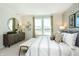 Bright main bedroom with scenic views, modern decor, and comfortable furnishings for relaxation at 7596 Bluegill Dr, Noblesville, IN 46062