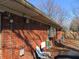 Brick home backyard featuring a fenced yard and mature trees, perfect for outdoor activities and privacy at 7625 Partridge Rd, Indianapolis, IN 46227