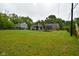 Expansive backyard with plenty of space for outdoor activities and entertaining, complete with a trampoline at 8172 Shottery Ter, Indianapolis, IN 46268