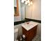 Bathroom featuring a ceramic sink with dark wood cabinets at 8172 Shottery Ter, Indianapolis, IN 46268