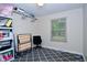 Clean and organized bedroom space with neutral tones and a large window at 8172 Shottery Ter, Indianapolis, IN 46268