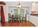 Cozy dining area next to the kitchen with a large window offering a scenic view of the outdoors at 8172 Shottery Ter, Indianapolis, IN 46268