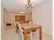 Inviting dining area with a marble-top table and a cozy chandelier lighting at 8172 Shottery Ter, Indianapolis, IN 46268