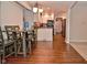 Bright dining area showcasing a table set with four chairs and a bench overlooking an open kitchen area at 8172 Shottery Ter, Indianapolis, IN 46268