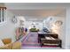 Well-lit basement space with colorful rug, modern furniture, and decorative accents at 8205 Bass Dr, Nineveh, IN 46164