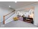 Basement staircase adjacent to a cozy seating area with stairs and contemporary decor at 8205 Bass Dr, Nineveh, IN 46164