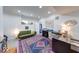 Bright basement with modern desk area, vibrant rug, and comfortable seating at 8205 Bass Dr, Nineveh, IN 46164