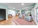 Expansive finished basement offering versatile space, cozy seating, and outdoor access at 8205 Bass Dr, Nineveh, IN 46164