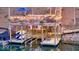 Well-equipped boat dock featuring a bar, seating, and multiple boat slips at 8205 Bass Dr, Nineveh, IN 46164