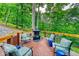 Outdoor deck features comfortable seating and a cozy fireplace, perfect for outdoor gatherings at 8205 Bass Dr, Nineveh, IN 46164