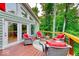 Inviting deck with seating area, fire pit, and direct access to the house, creating a cozy outdoor retreat at 8205 Bass Dr, Nineveh, IN 46164