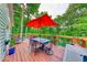 Outdoor deck with dining table, seating, and wooded views that is ideal for relaxing or entertaining at 8205 Bass Dr, Nineveh, IN 46164